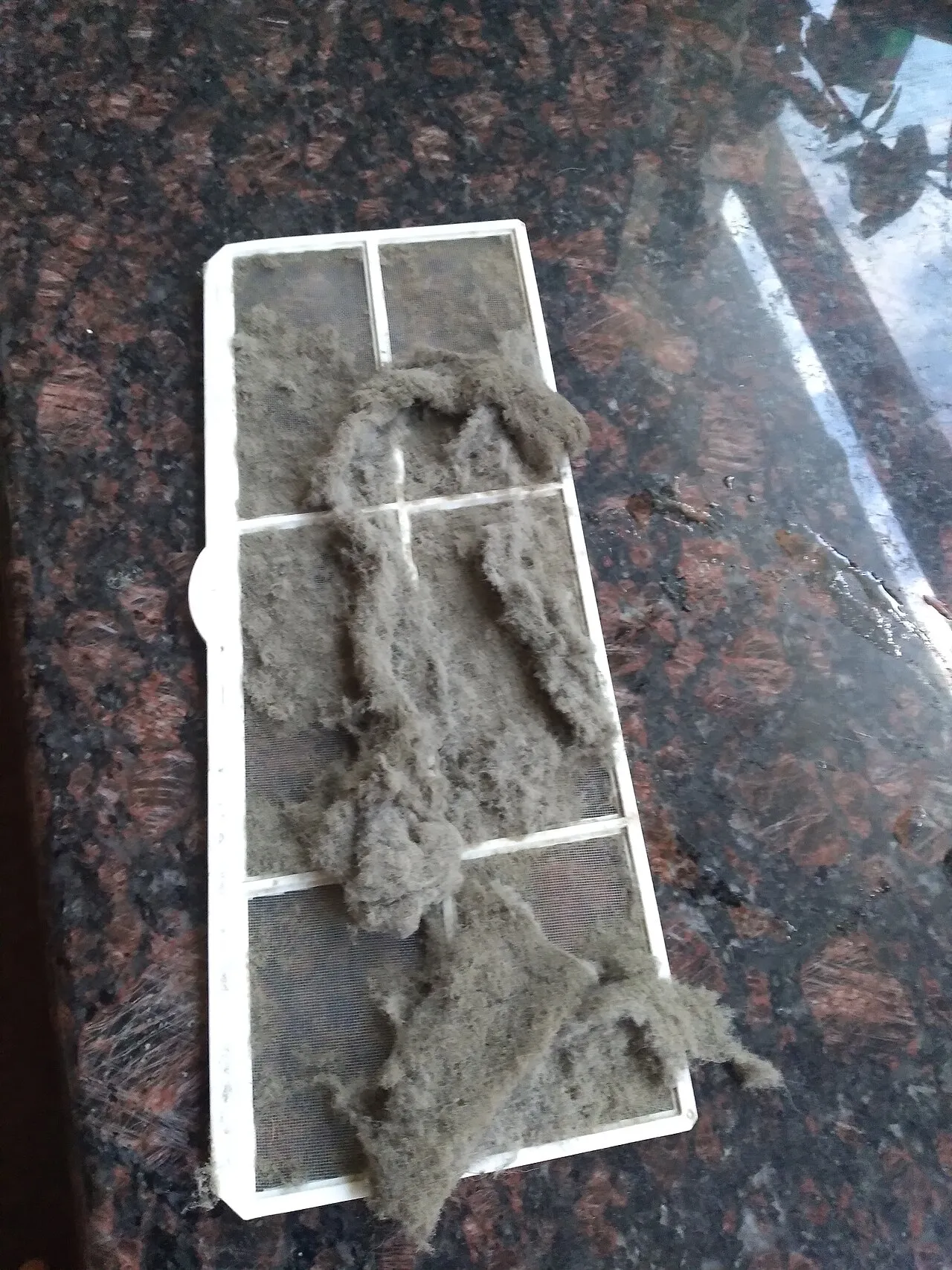 Heavily dust-clogged air conditioning filters, the most common cause of weak cooling